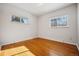 Sunny bedroom with hardwood floors and neutral decor at 12019 W Mexico Ave, Lakewood, CO 80228