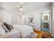 Bedroom with ensuite bathroom and hardwood floors at 12019 W Mexico Ave, Lakewood, CO 80228