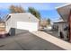 Detached two-car garage with driveway at 12019 W Mexico Ave, Lakewood, CO 80228