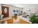 Bright living room featuring hardwood floors and comfy seating at 12019 W Mexico Ave, Lakewood, CO 80228