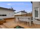 A backyard deck boasts outdoor dining seating with a modern aesthetic and built-in planter boxes at 4390 Osage St, Denver, CO 80211