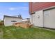 This fenced backyard features a deck with outdoor seating and a detached garage at 4390 Osage St, Denver, CO 80211