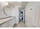 Bathroom featuring a single sink, granite countertops and a view of the hallway at 4390 Osage St, Denver, CO 80211