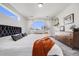 Inviting bedroom with modern decor, large window, and a cozy bed, creating a peaceful retreat at 4390 Osage St, Denver, CO 80211