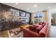 Stylish living room featuring tile wall, fireplace, and access to outdoor patio perfect for entertaining at 4390 Osage St, Denver, CO 80211