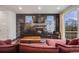 Inviting living room featuring a cozy fireplace, stylish tile wall, and comfortable seating area for relaxation at 4390 Osage St, Denver, CO 80211