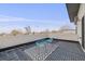 Charming roof deck features light-blue chairs and a decorative area rug with a neighborhood view at 4390 Osage St, Denver, CO 80211