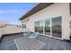 Relax on this roof deck featuring sliding glass doors, modern furniture, and a sleek, patterned rug at 4390 Osage St, Denver, CO 80211