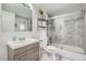 Modern bathroom with gray vanity, marble tile, glass shower doors, and updated fixtures at 2740 W 86Th Ave # 190, Westminster, CO 80031