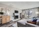 Inviting living room with fireplace, tv and hardwood flooring at 2740 W 86Th Ave # 190, Westminster, CO 80031