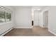Carpeted bedroom with a window and view to the exterior and attached bathroom at 5875 E Iliff Ave # 108, Denver, CO 80222