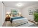 Cozy primary bedroom offers ample natural light and comfortable layout for relaxation and rest at 5875 E Iliff Ave # 108, Denver, CO 80222