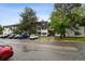 Well-manicured complex featuring ample parking and mature trees providing shade and privacy at 5875 E Iliff Ave # 108, Denver, CO 80222