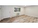Bright and airy living space with large window and neutral color palette with views of the exterior at 5875 E Iliff Ave # 108, Denver, CO 80222