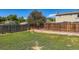 Spacious backyard featuring a grass lawn and wood fence, ready for outdoor enjoyment at 4533 S Devinney St, Morrison, CO 80465