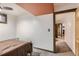 Bedroom featuring neutral walls, a light-colored carpet, and an entryway at 4533 S Devinney St, Morrison, CO 80465