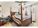 Bedroom with a four-poster bed, a ceiling fan, and a comfortable carpet at 4533 S Devinney St, Morrison, CO 80465