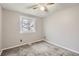 Bedroom featuring neutral walls, carpeted floors, a ceiling fan, and a window at 4533 S Devinney St, Morrison, CO 80465