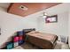 Cozy bedroom with neutral color palette, ceiling fan, and window with natural light at 4533 S Devinney St, Morrison, CO 80465