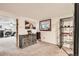 Bedroom with gray walls, wood dresser and decor shelves with view into another living area at 4533 S Devinney St, Morrison, CO 80465