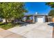 Traditional home with an attached garage and a wide driveway at 4533 S Devinney St, Morrison, CO 80465
