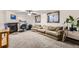Living room with fireplace, desk, couch, and natural light from two windows at 4533 S Devinney St, Morrison, CO 80465