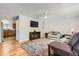 Cozy living room featuring hardwood floors and a ceiling fan at 4533 S Devinney St, Morrison, CO 80465