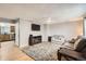 Spacious living room with hardwood floors, comfortable seating, and a view into the kitchen at 4533 S Devinney St, Morrison, CO 80465