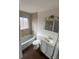Clean, modern bathroom with tiled shower and updated vanity at 2017 Ironton St, Aurora, CO 80010