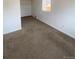 This bedroom has neutral colored walls and new carpets throughout at 2017 Ironton St, Aurora, CO 80010