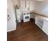 This kitchen has white appliances and cabinets, and plenty of open counter space at 2017 Ironton St, Aurora, CO 80010
