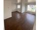 Spacious living area with hardwood flooring and large windows providing natural light at 2017 Ironton St, Aurora, CO 80010