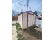 A storage shed with painted wood siding and trim stands ready for tools at 2017 Ironton St, Aurora, CO 80010