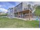 Spacious backyard features a patio, upper deck, lush lawn, and play equipment at 9786 Malachite Ct, Parker, CO 80134
