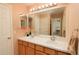 Bright bathroom features a dual sink vanity, large mirror, and neutral color palette at 9786 Malachite Ct, Parker, CO 80134