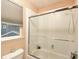 Cozy bathroom features a tiled shower, shower caddy, and tub with a glass enclosure at 9786 Malachite Ct, Parker, CO 80134