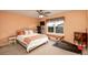 Comfortable bedroom featuring a ceiling fan, a window, and carpeted floors at 9786 Malachite Ct, Parker, CO 80134