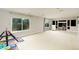 Spacious bonus room with large windows and a seating area provides ample natural light at 9786 Malachite Ct, Parker, CO 80134