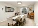 Formal dining room features a large table, decorative mirror, and neutral decor at 9786 Malachite Ct, Parker, CO 80134