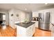 Eat-in kitchen featuring an island with bar seating, stainless steel appliances, and a functional layout at 9786 Malachite Ct, Parker, CO 80134