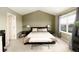 Bedroom featuring vaulted ceiling, soft carpet, and plenty of natural light from a large window at 9786 Malachite Ct, Parker, CO 80134