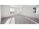 Bright bedroom with lots of natural light, neutral carpet, and fresh, neutral paint at 1401 Bloom St, Brighton, CO 80601