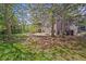 Backyard with a hot tub, wooden deck, garden, and shade trees perfect for relaxation at 2732 Flint Ct, Superior, CO 80027