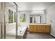 Elegant bathroom featuring double vanity, separate shower, soaking tub and large, bright windows at 2732 Flint Ct, Superior, CO 80027