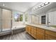 Spacious bathroom with dual vanities, large mirror, and soaking tub with a separate shower stall at 2732 Flint Ct, Superior, CO 80027