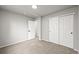 A carpeted bedroom featuring a closet and a doorway leading to another room at 2732 Flint Ct, Superior, CO 80027