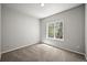 A carpeted bedroom with a large window providing ample natural light at 2732 Flint Ct, Superior, CO 80027