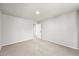 A spacious bedroom featuring neutral walls, carpet, and an open doorway at 2732 Flint Ct, Superior, CO 80027