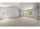 Spacious bedroom with vaulted ceiling, large windows providing natural light, and neutral carpeting at 2732 Flint Ct, Superior, CO 80027