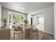 Bright dining room with large bay window offering scenic views, neutral paint, and modern decor at 2732 Flint Ct, Superior, CO 80027